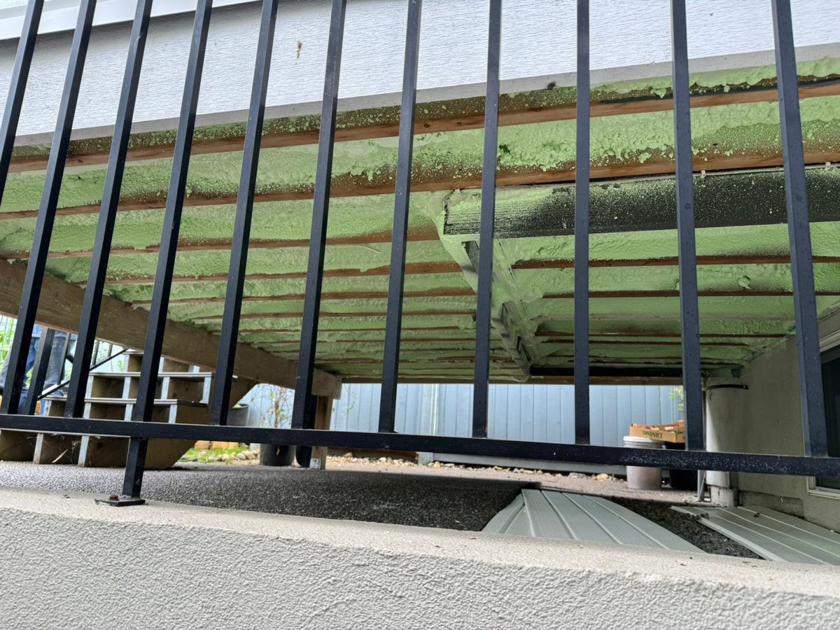 Steel-stud framing with sprayed assembly behind